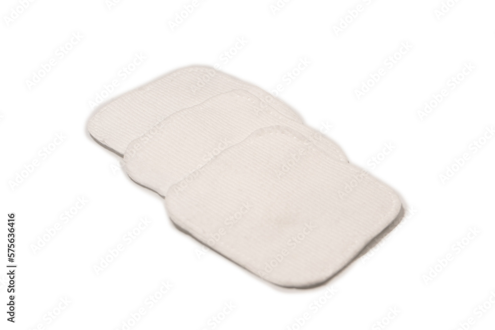 Stack of white cotton sponges isolated on a white background. Stack of white cotton sponges isolated on a white background.