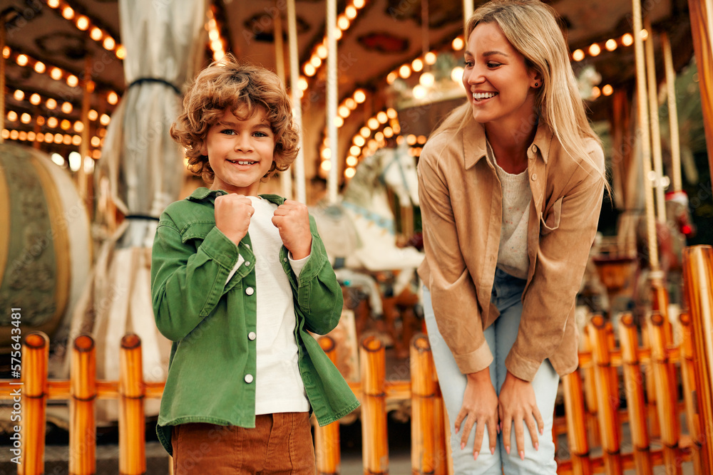 Kids having fun on a carnival Carousel Kids having fun on a carnival Carousel