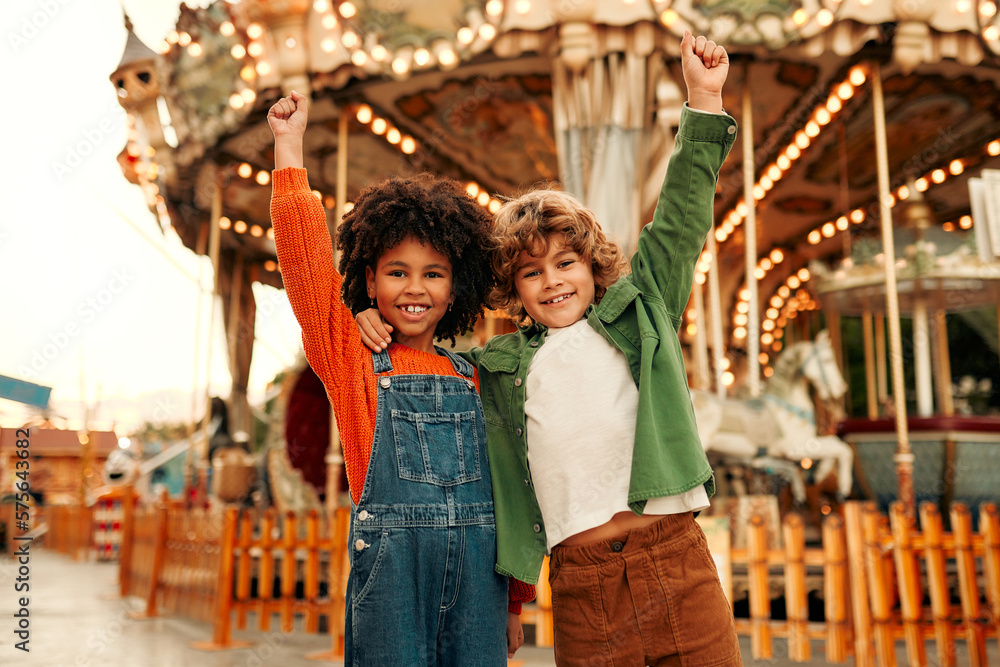 Fototapeta premium Kids having fun on a carnival Carousel