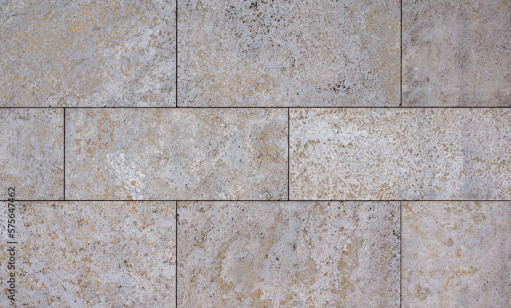 natural stone wall texture as background. Close-up of a wall clad in limestone natural stone wall texture as background. Close-up of a wall clad in limestone