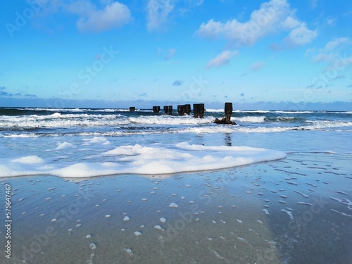 Old groynes at the coast of the Baltic Sea in the north of Germany photo