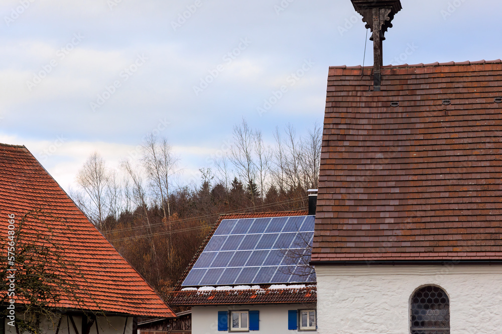 Photovoltaic system on the roof of a farmhouse in Gaishaus near Ravensburg in Baden Würtemberg on a cloudy day in winter Photovoltaic system on the roof of a farmhouse in Gaishaus near Ravensburg in Baden Würtemberg on a cloudy day in winter