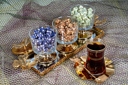 Delicious Turkish delight and candies served with tea in glass bowls