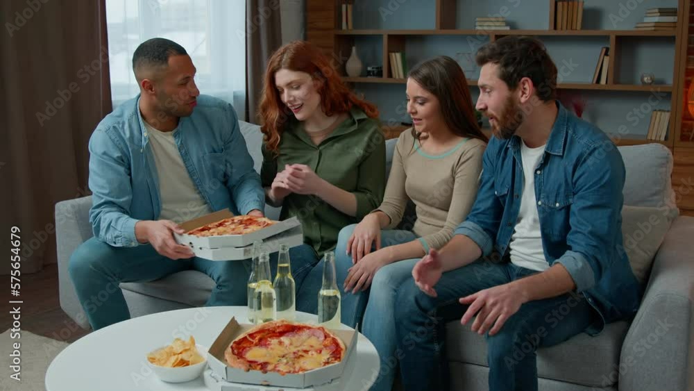 Multi ethnic group team people sit at festive table share italian pizza with men women diverse multiracial friends talking laughing eat meal slices tasty lunch eating dinner celebrating party at home Multi ethnic group team people sit at festive table share italian pizza with men women diverse multiracial friends talking laughing eat meal slices tasty lunch eating dinner celebrating party at home