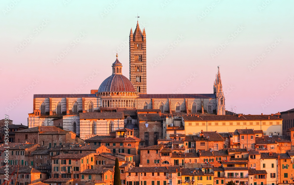 Bell Tower and Cathedral of Siena in Tuscany at sunset