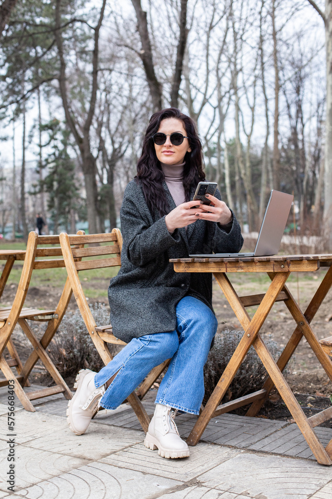 Beautiful businesswoman working on a laptop. Female freelancer connecting to internet via computer. Blogger or journalist writing new article. Beautiful businesswoman working on a laptop. Female freelancer connecting to internet via computer. Blogger or journalist writing new article.