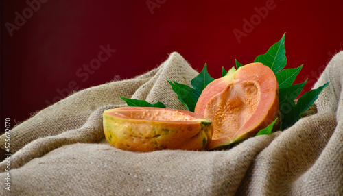 Ripe papaya placed on a jute cloth. Fresh Yellow sweet papaya on sale.