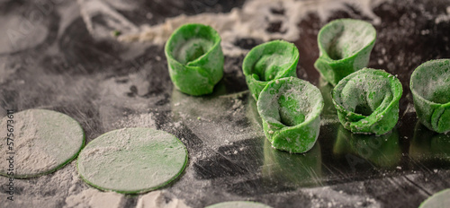 Green ravioli with ricotta cheese, spinach. Long banner format. top view photo