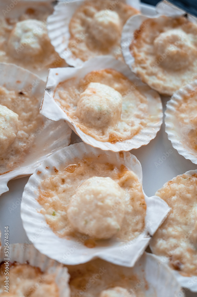 Plate with delicacy roasted scallops with cheese Plate with delicacy roasted scallops with cheese