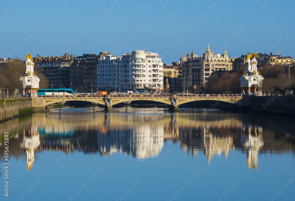 Buildings of the city of Donostia-San Sebastian are reflected in the Urumea river.