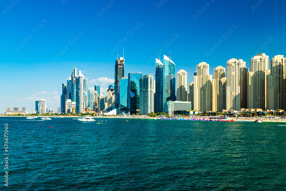 Dubai feaes a landscape and together with modern buildings. beach, shore, sea , resort