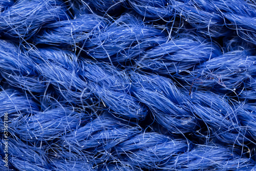 The macro texture of the blue cotton fiber cloth.