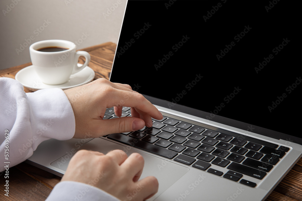 Businesswoman is working with a laptop for a new project. Designer.General design of laptop on the table. Business women busy using laptop at the office table. MOCAP. Place for text. Place to copy. Businesswoman is working with a laptop for a new project. Designer.General design of laptop on the table. Business women busy using laptop at the office table. MOCAP. Place for text. Place to copy.