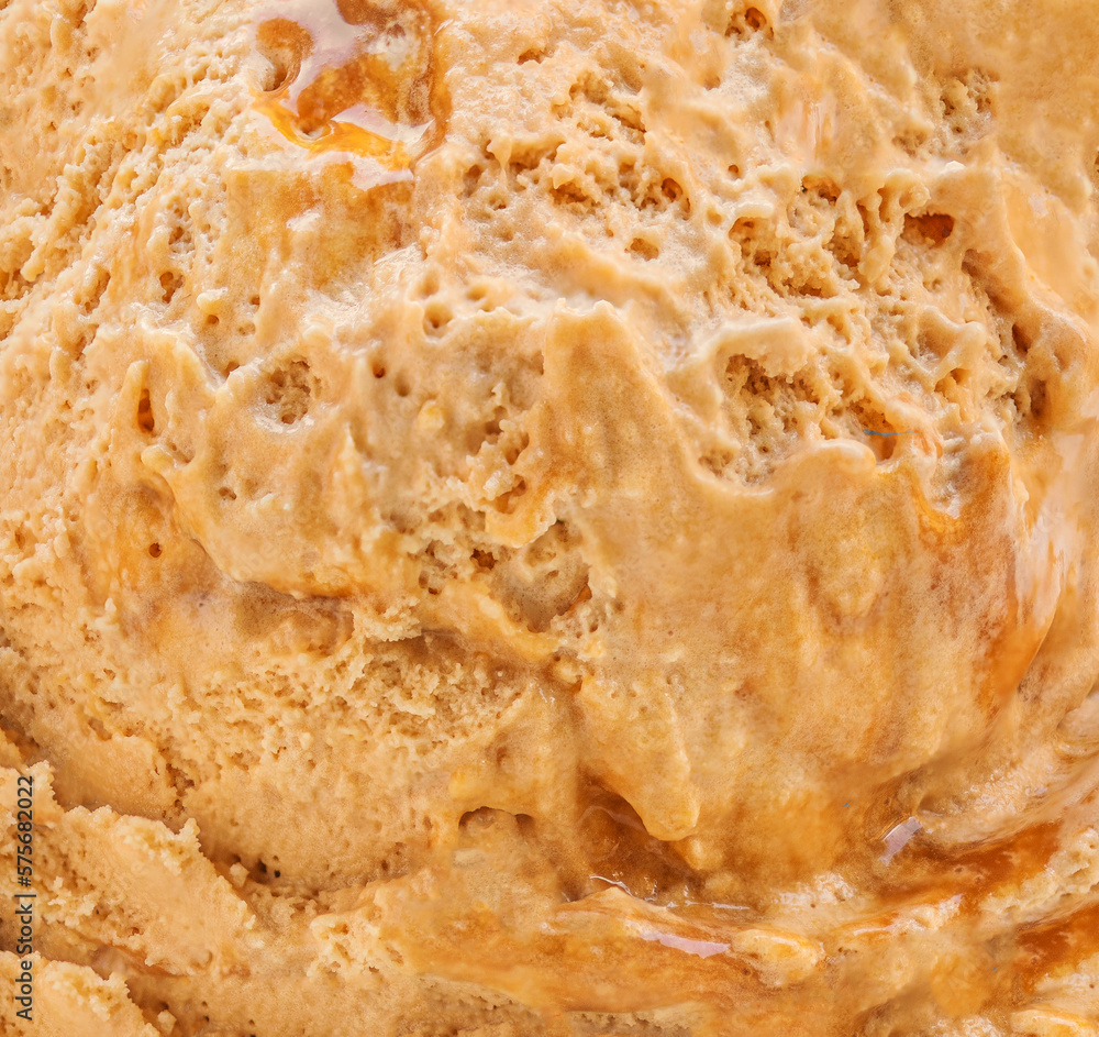 Caramel icecream detailed macro texture. Dark tofffee caramel ice cream surface. Caramel icecream detailed macro texture. Dark tofffee caramel ice cream surface.