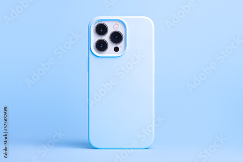 iPhone 13 and 14 Pro Max in blue case back view isolated on blue background, phone cover mock up in monochrome colours
