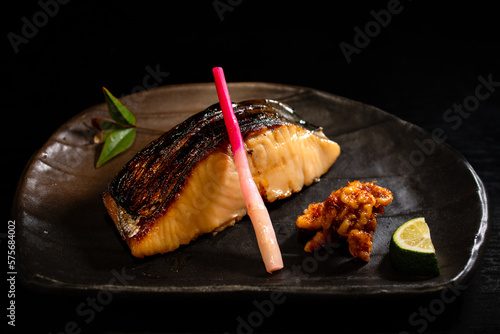 Fototapeta Naklejka Na Ścianę i Meble -  鰆の塩焼き　黒背景　俯瞰
