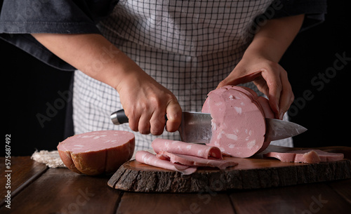 Mortadella. Traditional pork sausage with pistachios or black pepper. Italian delicacy from Bologna. High quality 4k footage photo