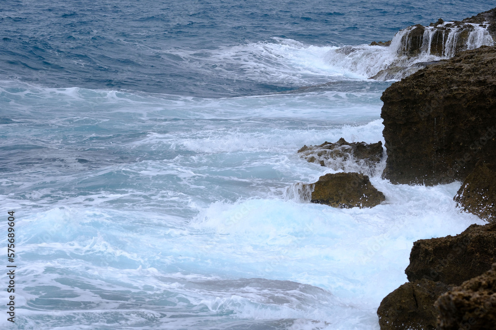 waves breaking on a Tuscan cliff