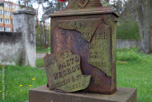 A cast-iron (broken) plaque on the grave of an Evangelical pastor from Węgrów