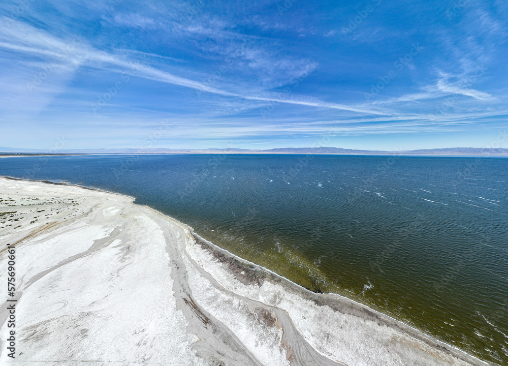 An Aerial UAV Drone View of the West Coast of the Salton Sea Near Thermal, California, Showing the Evaporated Salts from the Water and the abandoned Marina with the Infrastructure Seen in the Salt An Aerial UAV Drone View of the West Coast of the Salton Sea Near Thermal, California, Showing the Evaporated Salts from the Water and the abandoned Marina with the Infrastructure Seen in the Salt