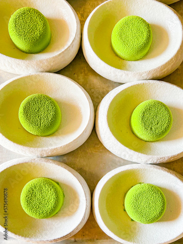 Mousse green cakes made from delicate cream mousse. small one-bite cakes are called petit fours.at catering event on some festive event,party or wedding