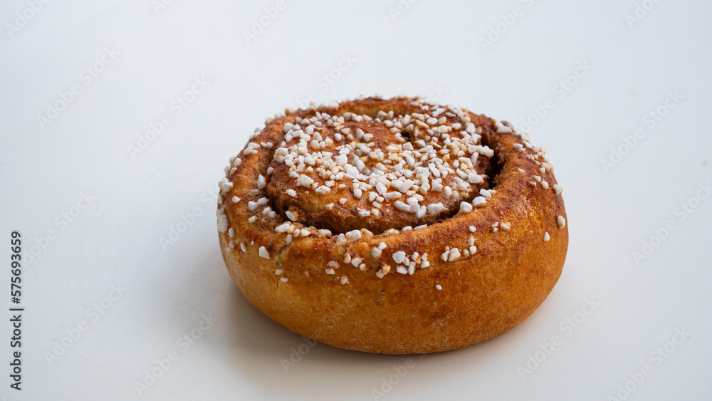 Isolated cinnamon bun on white background. 