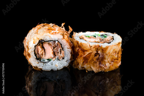 Sushi rolls with tuna, cream cheese, cucumber in dry shavings of tuna.