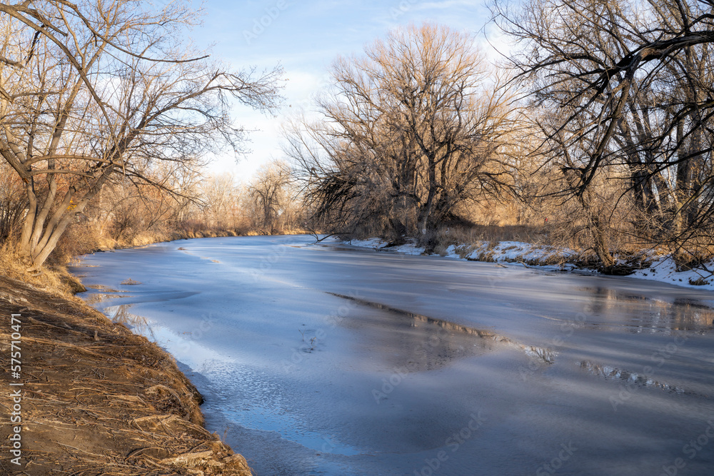winter scenery of frozen Poudre River in Fort Collins, Colorado winter scenery of frozen Poudre River in Fort Collins, Colorado