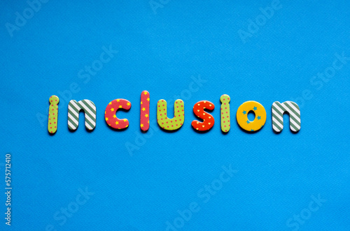 word inclusion on blue paper background