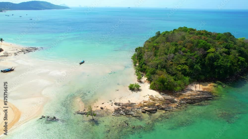 Drone flying over the sandbar, it reveals a picturesque view of the tropical island from a unique angle. The crystal-clear waters surrounding the sandbar make for an unforgettable travel experience.
Drone flying over the sandbar, it reveals a picturesque view of the tropical island from a unique angle. The crystal-clear waters surrounding the sandbar make for an unforgettable travel experience.