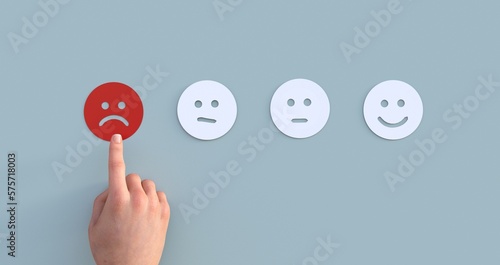 client's hand picked the happy face smile face, Customer service evaluation and satisfaction survey concept. copy space