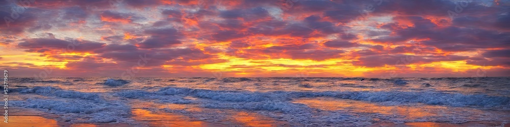 Fototapeta premium Sandy deserted beach with ocean waves on the shore. Skies and water meet on the horizon by generative AI
