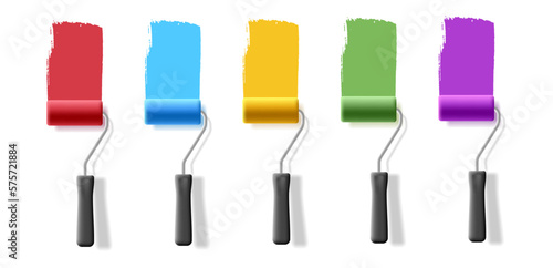 3d set of rollers for painting walls, with colorful stripes of paint on the wall. Roller brushes for building concepts for external and internal use.