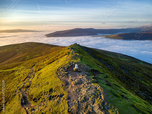 Canvas Print Aerial view of mountains rising about a sea of cloud at dusk (Brecon Beacons)