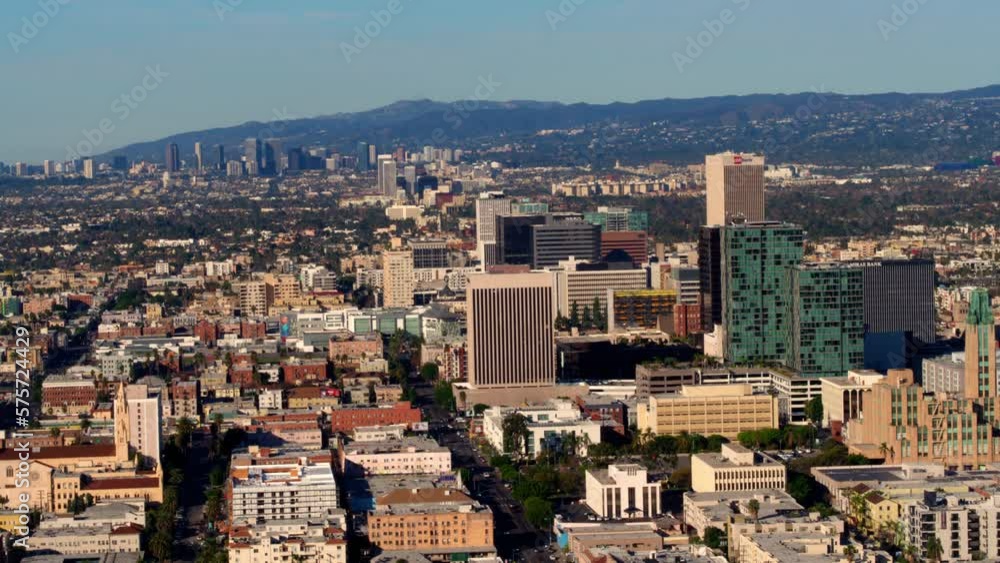 Aerial Backward Shot Of Modern Buildings In City Under Clear Sky On Sunny Day - Los Angeles, California Aerial Backward Shot Of Modern Buildings In City Under Clear Sky On Sunny Day - Los Angeles, California
