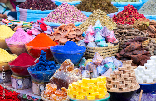 Organic products in ethnic arabian fair in Marrakesh, Morocco. Various kinds of condiments and precious goods put in wattled handmade baskets