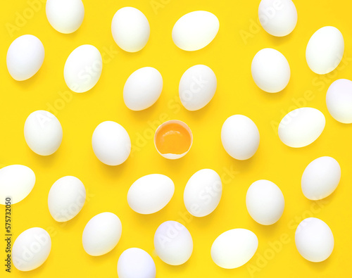 Pattern from chicken white eggs,yolk and half eggs iyellow background. Concept of foods rich in vitamin D. Diet product. Close-up