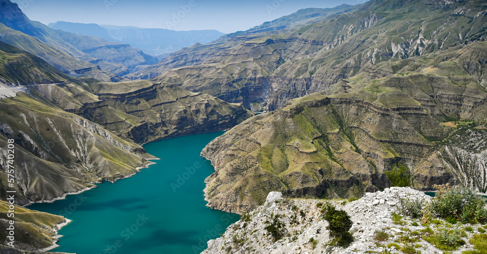 Fototapeta premium Beautiful panoramic view of the mountains and the river in the Sulak Canyon on a sunny summer day. Dagestan
