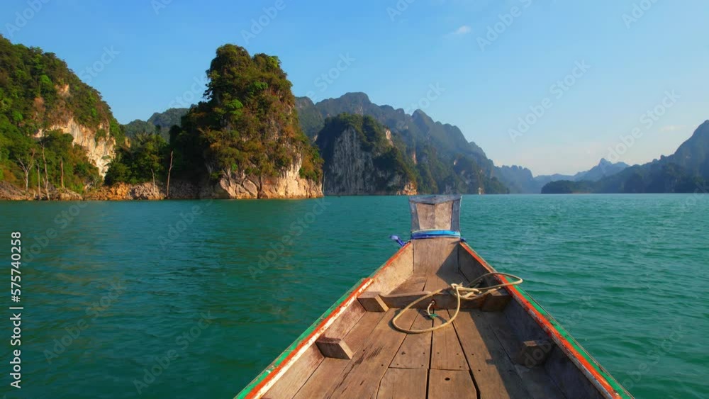 Take a longtail boat tour on Thailand's tranquil lake, surrounded by