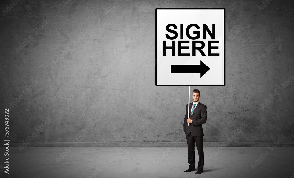 business person holding a traffic sign business person holding a traffic sign