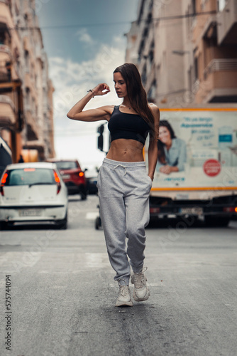 Active Lifestyle: Fitness Woman Walking on City Streets © Moose