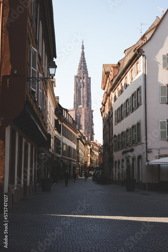 Parisian cityscape, with typical Parisian architecture and landmarks like the sa creu coeur and the Eiffel Tower can be seen. The picture was taken near the square pigalle.