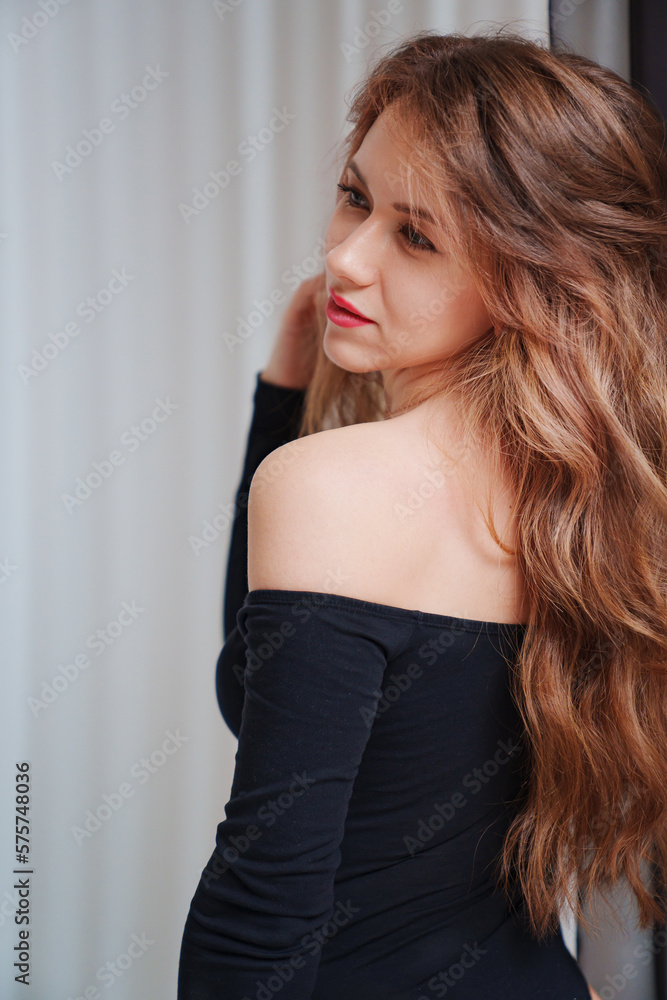 portrait of a beautiful sexual woman in a black bodysuit portrait of a beautiful sexual woman in a black bodysuit