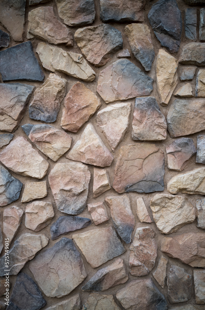Profile View of a Tan, White, and Gray Stone Wall. Profile View of a Tan, White, and Gray Stone Wall.