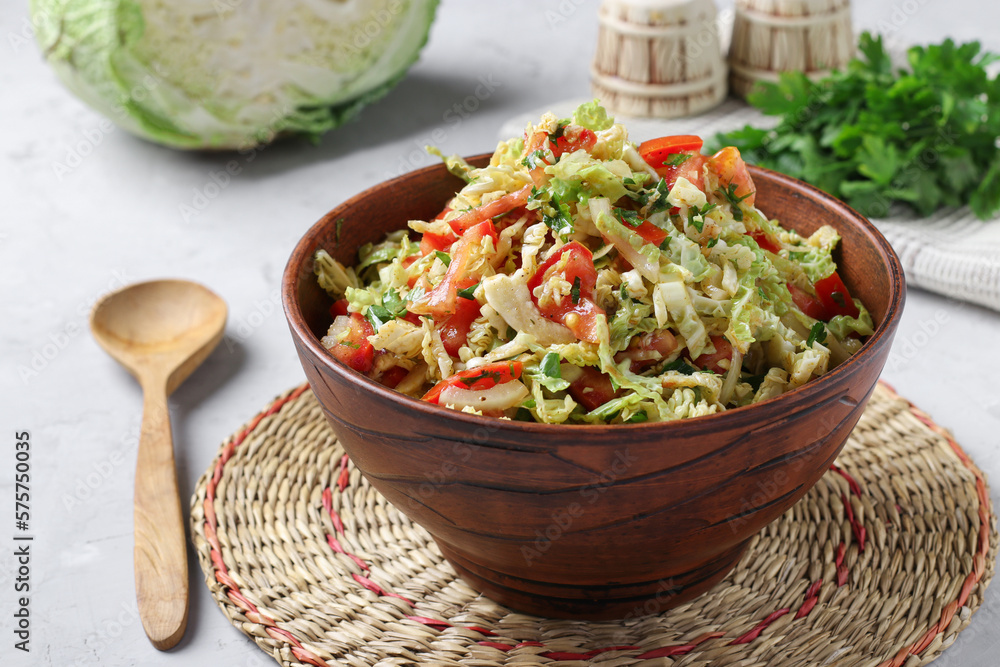 Salad with savoy cabbage, tomatoes and parsley in brown bowl Salad with savoy cabbage, tomatoes and parsley in brown bowl