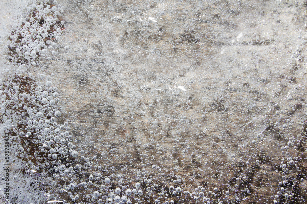 Obraz premium Close up photo texture of frozen ice on concrete surface.