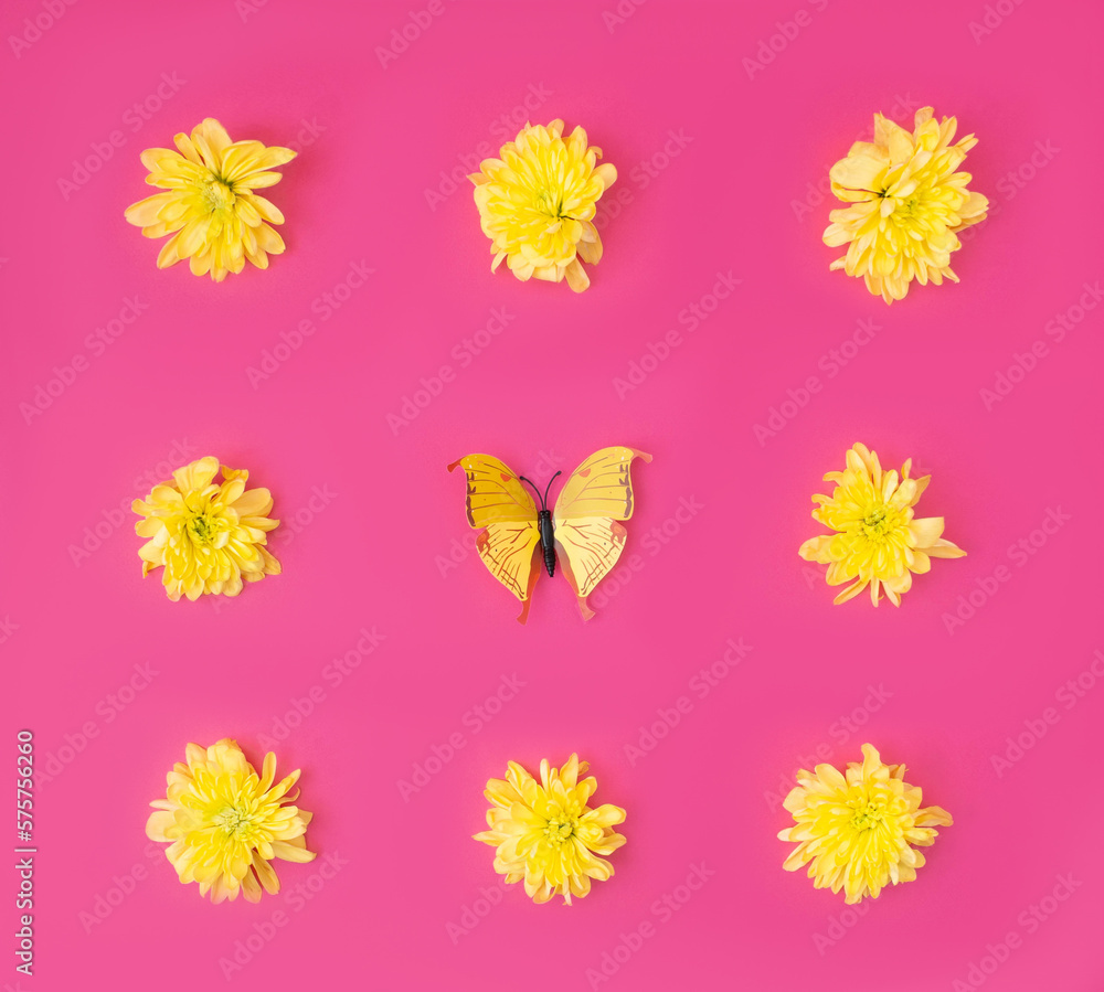 A vibrant spring summer wallpaper with yellow dandelion flower heads and a yellow butterfly against magenta background. Flat lay.
