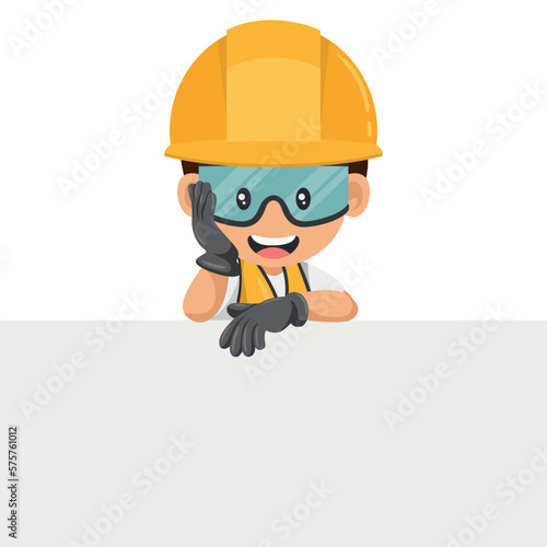 Industrial worker in his personal protective equipment holding a sign with copy space for text for advertising, presentation, brochures. Industrial safety and occupational health at work