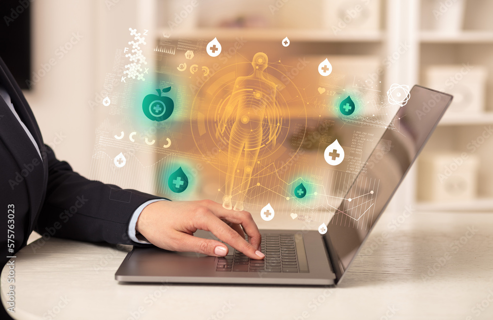Doctor working on laptop with healthcare concept Doctor working on laptop with healthcare concept