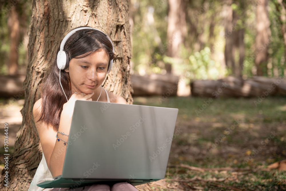 woman working with laptop notebook in forest woman working with laptop notebook in forest